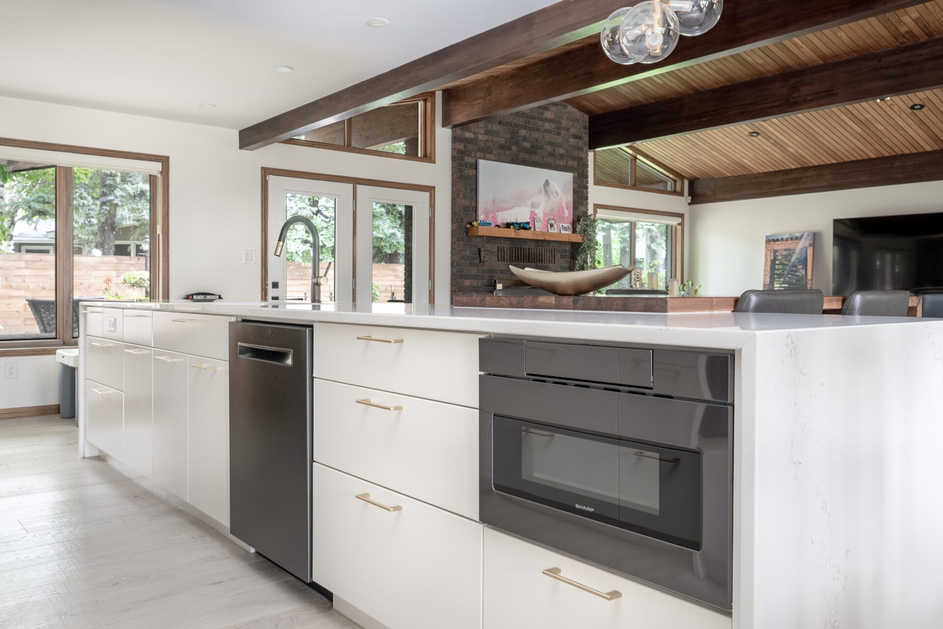 Try Me Cabinets Hi Res-72 Nathan Dyck a kitchen with hardwood floors and a dining table